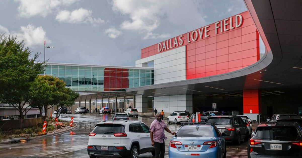 Dallas Love Field terminal with cars at the curb